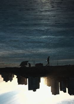 Triple Exposure Photo of Water, People Walking and City 