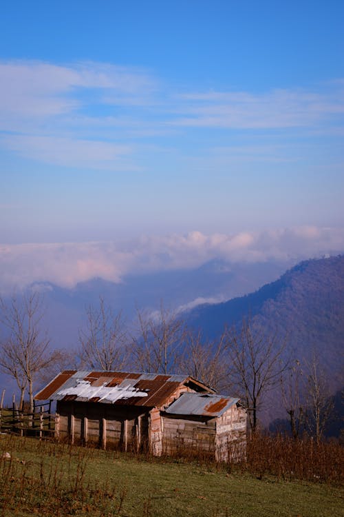 Brown Wooden House on Top of Mountain