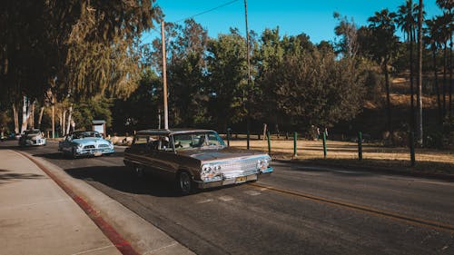 Photo of Classic Cars on Roadway