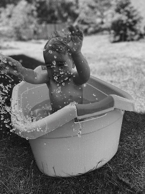 Free Grayscale Photo of Baby in Bathtub Stock Photo