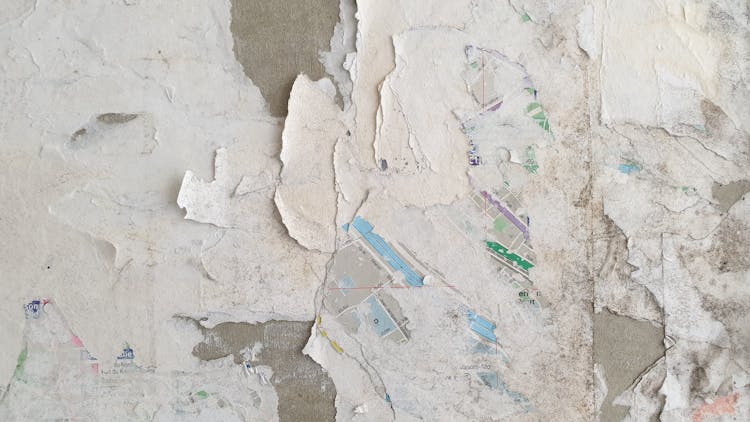 Concrete Wall With Peeled Off Paper And Paint