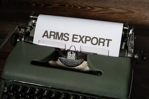 A White Bond Paper with Arms Export Text on a Typewriter
