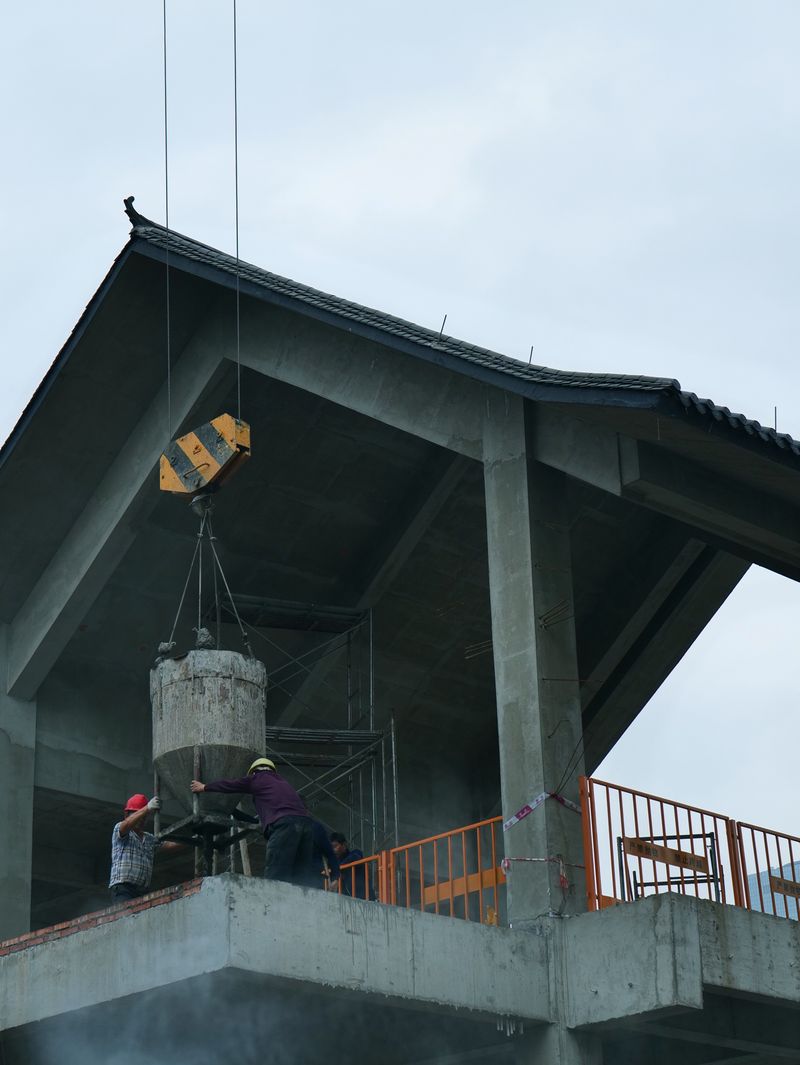 Workers pouring concrete on a commercial build