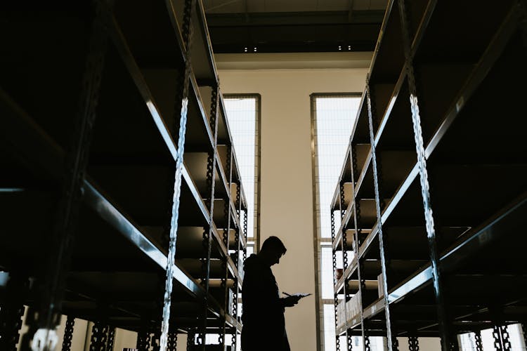 Person With Clipboard In Warehouse