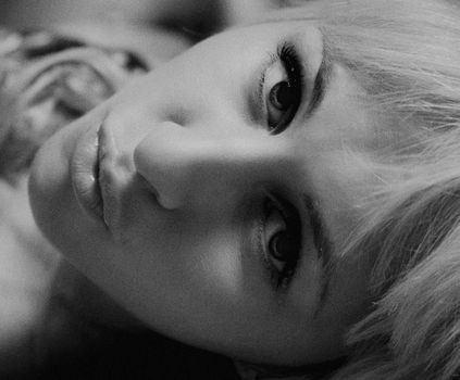 Emotive black and white portrait of a woman with expressive eyes, Kyiv.