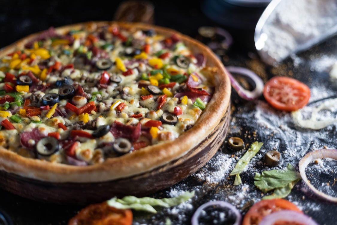 Free A Whole Pizza on a Wooden Board Stock Photo