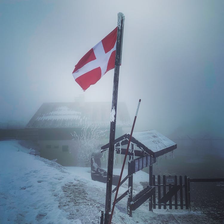 Fog Over Danish Flag In Village