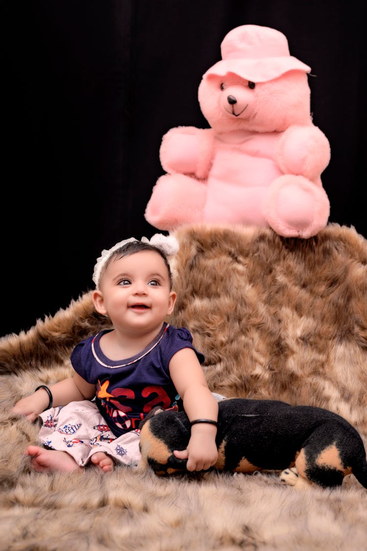 Baby Girl On A Fur Carpet