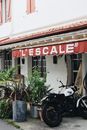Black Motorcycle Parked Beside Green Plants