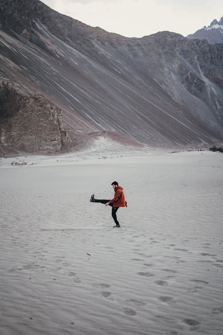 Man Kicking Sand