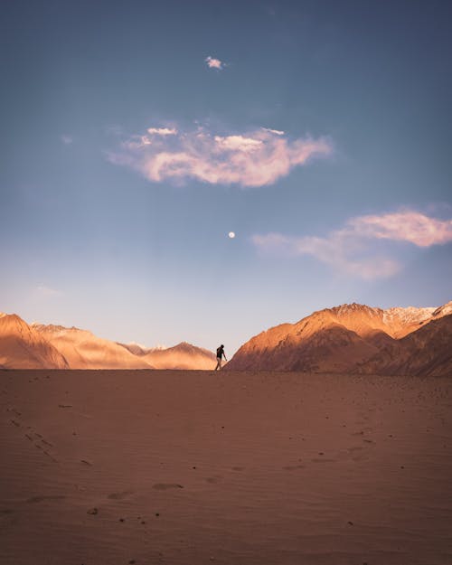 Free Person Walking in Desert Stock Photo