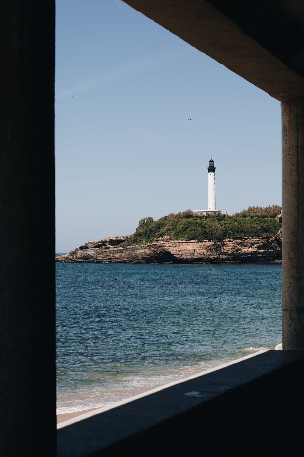 Lighthouse Seen From a Window · Free Stock Photo