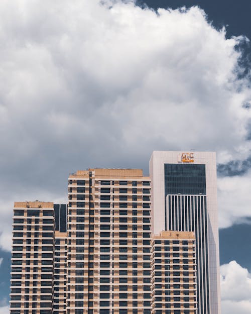 White and Brown Concrete Building Under White Clouds