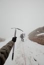 A Person Holding an Ice Axe