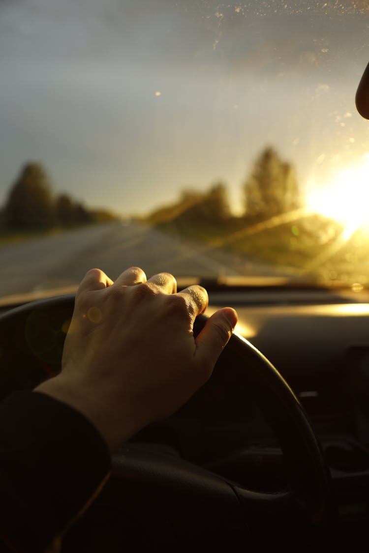 Photo Of Person Driving A Car