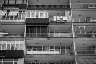 A Grayscale Photo of an Apartment Building with Balconies