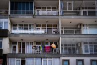 An Apartment Building with Balconies and Glass Windows