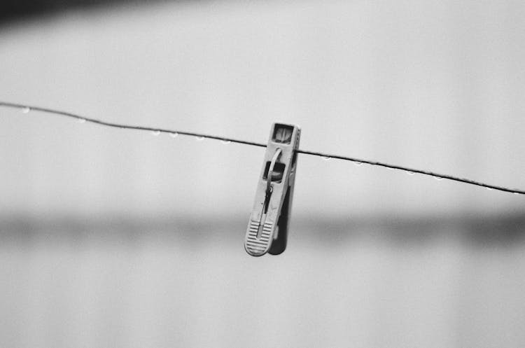 Black And White Photo Of Clip On A Wire