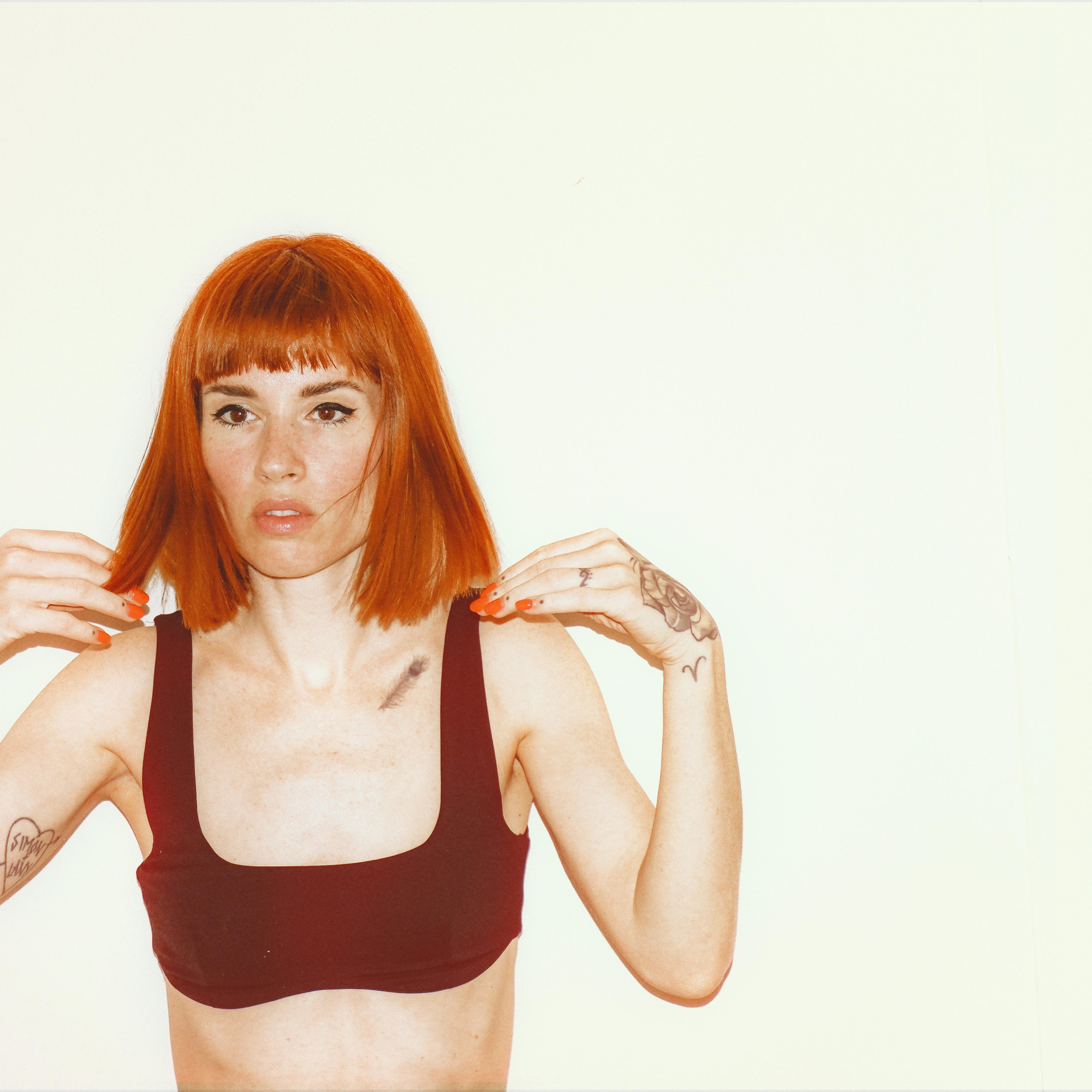 Woman in Black Sports Bra Posing