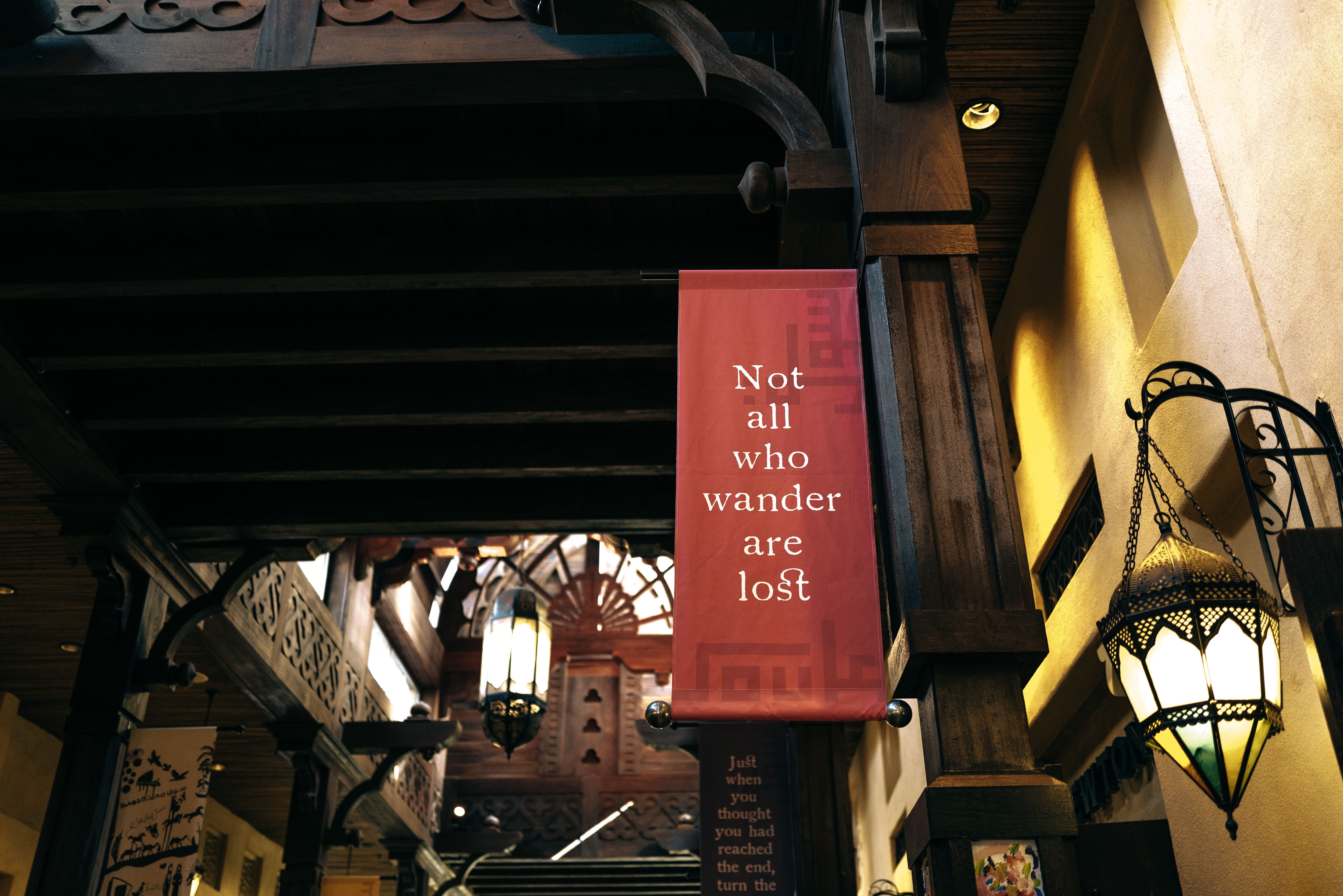 Rustic indoor setting featuring vintage lanterns and an inspirational quote banner.