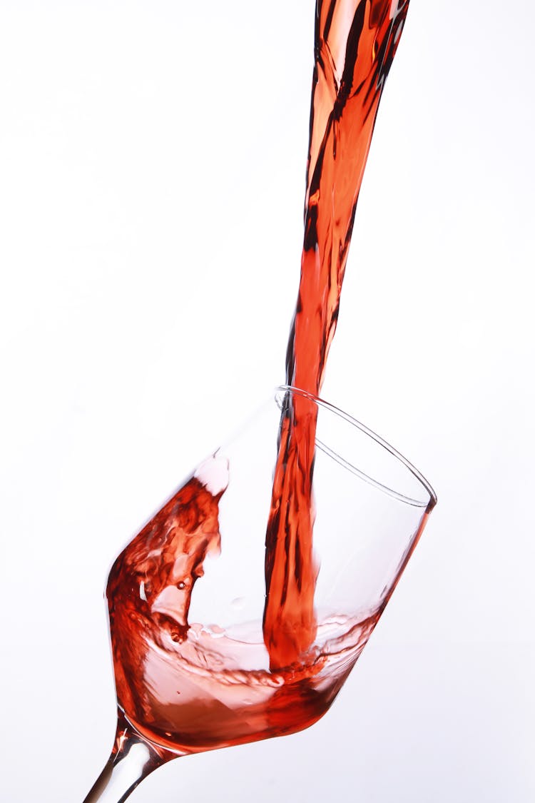 Pouring Wine On Glass