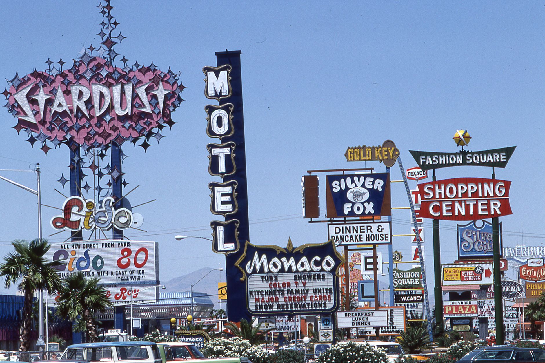 Mid-Strip hotel exterior with neon signage
