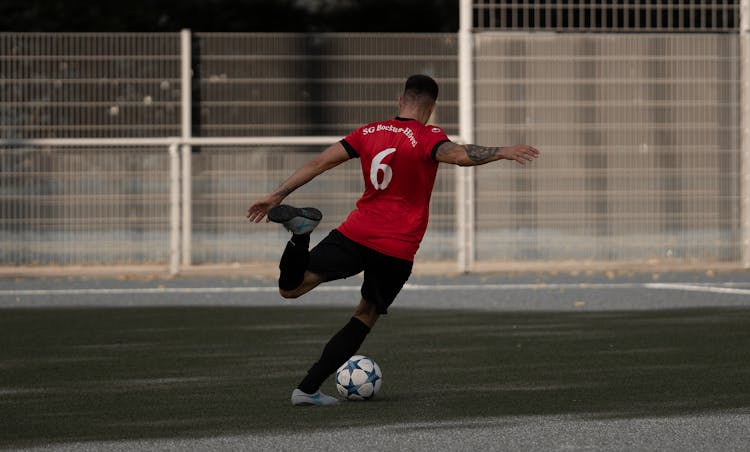 Football Player Shooting Ball