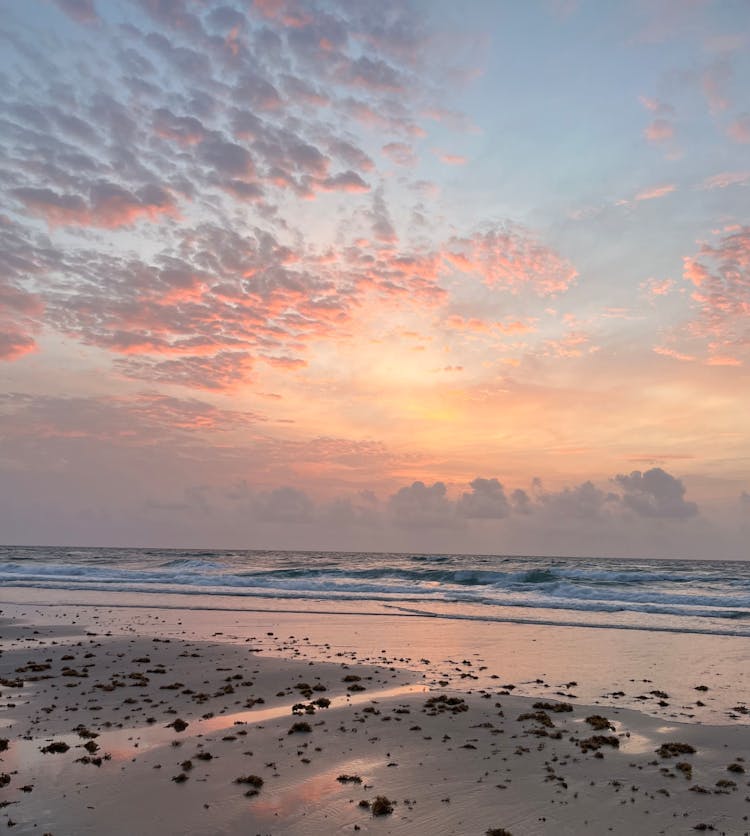 Sunrise In A Blue And Pink Sky At A Beach