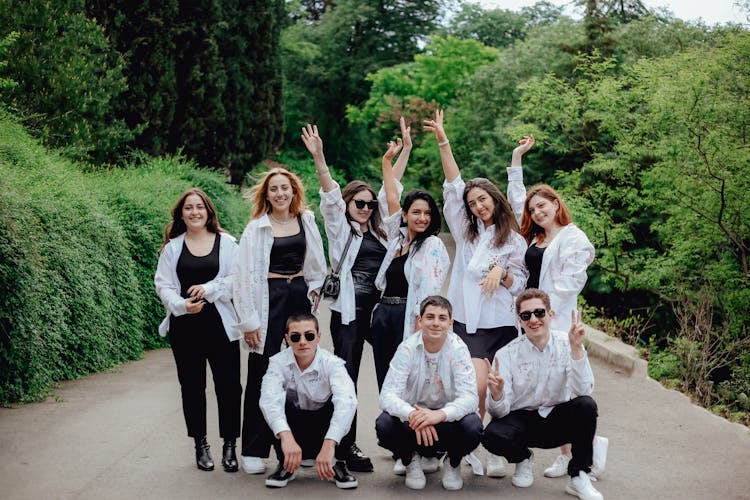 Group Photo Of Young People In White Shirts