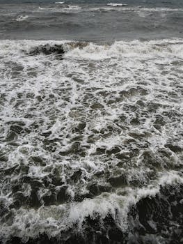 A captivating aerial shot of churning ocean waves with rich textures.