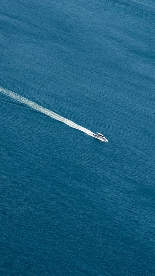Free Birds Eye View of a Boat at Sea Stock Photo