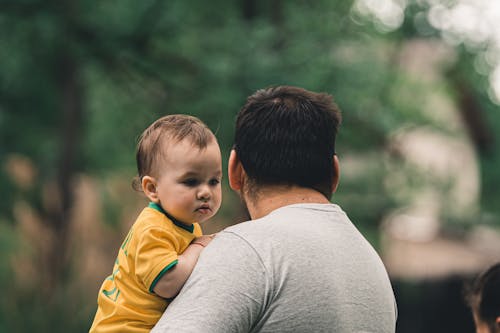 Man Holding a Baby