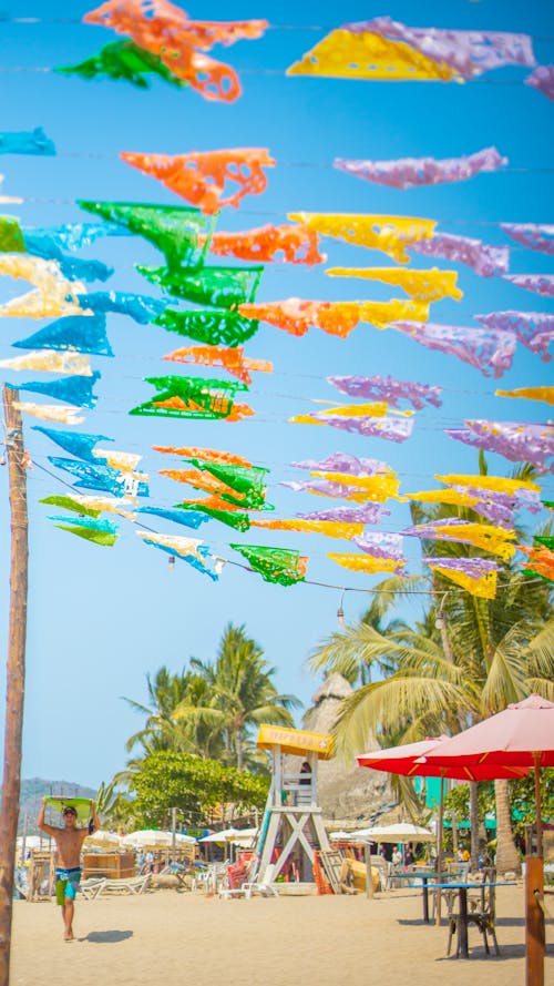 Colorful Flags Above Beach