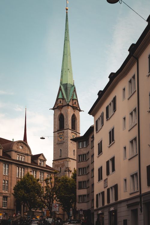 Free Stunning view of the historic Fraumünster Abbey tower in Zurich, surrounded by classic architecture. Stock Photo