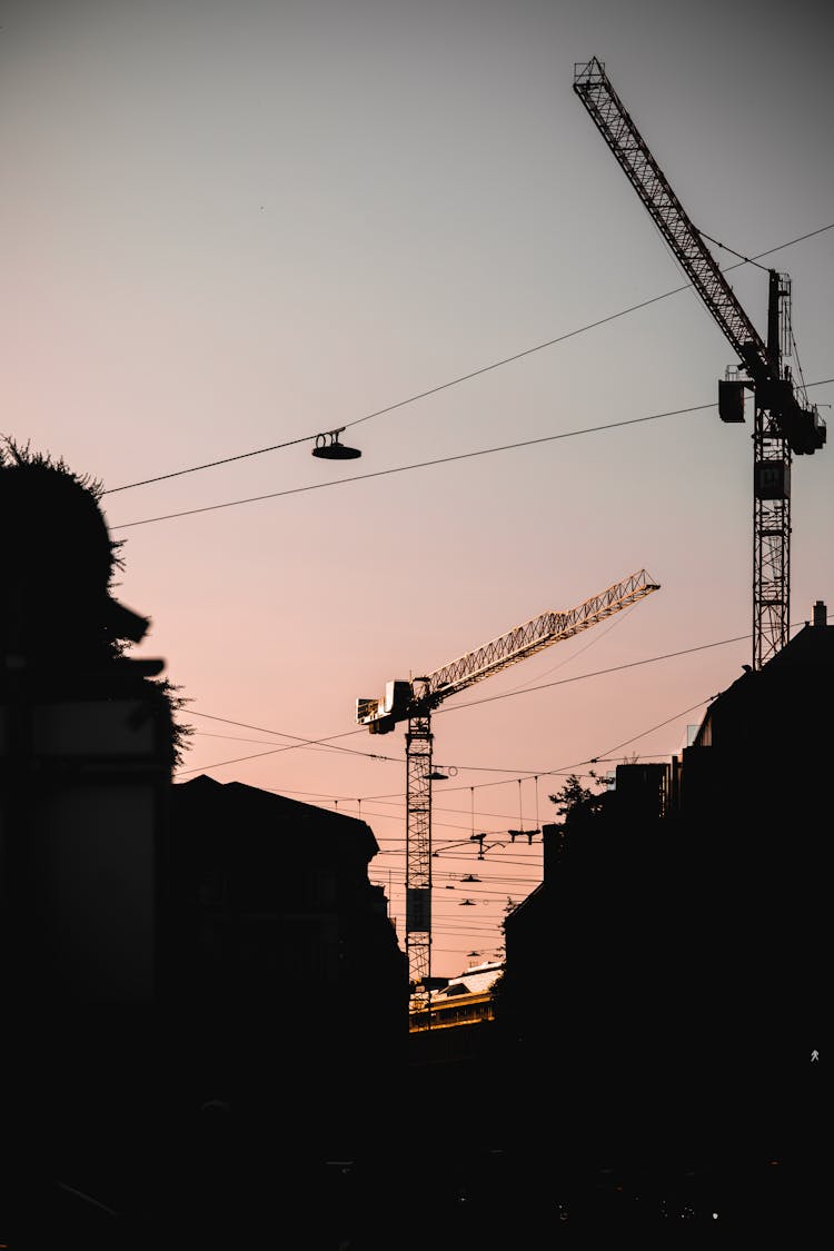 Silhouette Of Tower Cranes