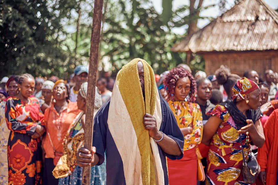 People in ceremonial dress participating in a traditional African ritual — iboga ceremony unfolds over three distinct phases across 12–24 hours of active experience