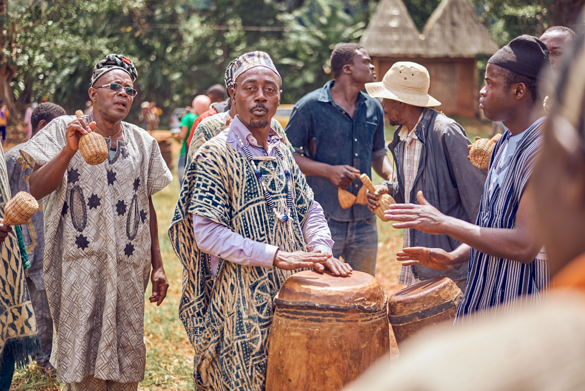 Men performing traditional music at a vibrant cultural festival in Batoufam, Cameroon.