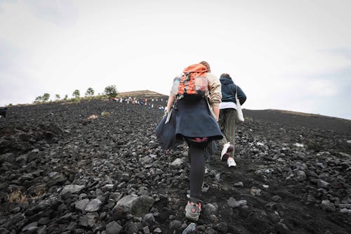 People Walking on a Rocky Mountain