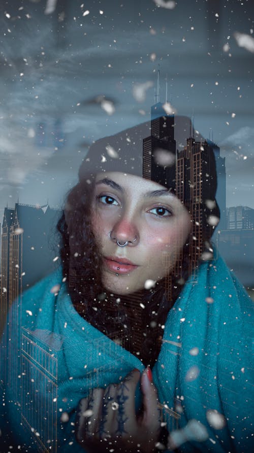 Free A Woman in Blue Scarf Looking with a Serious Face Stock Photo