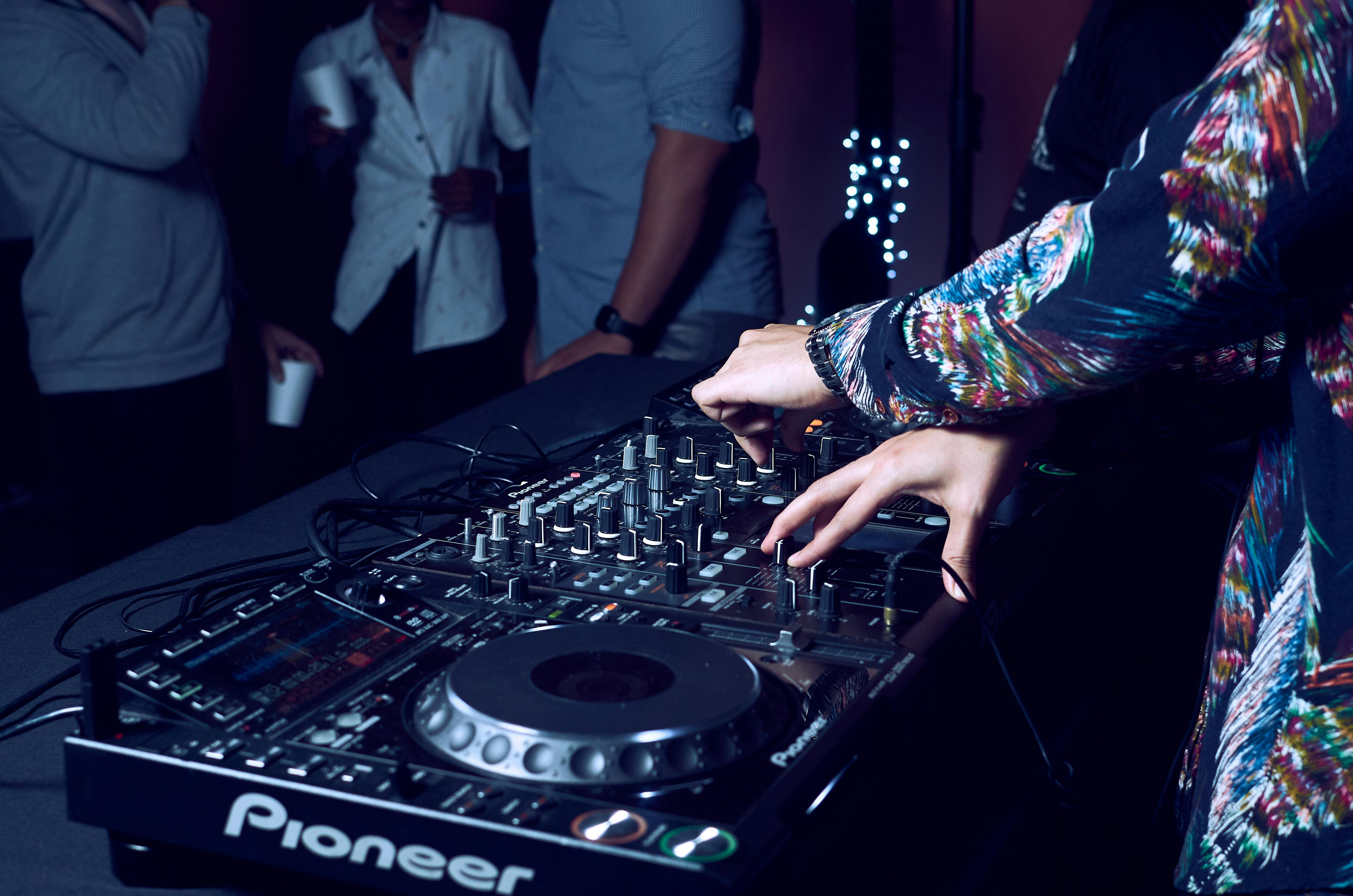 A Person Using DJ Mixer · Free Stock Photo