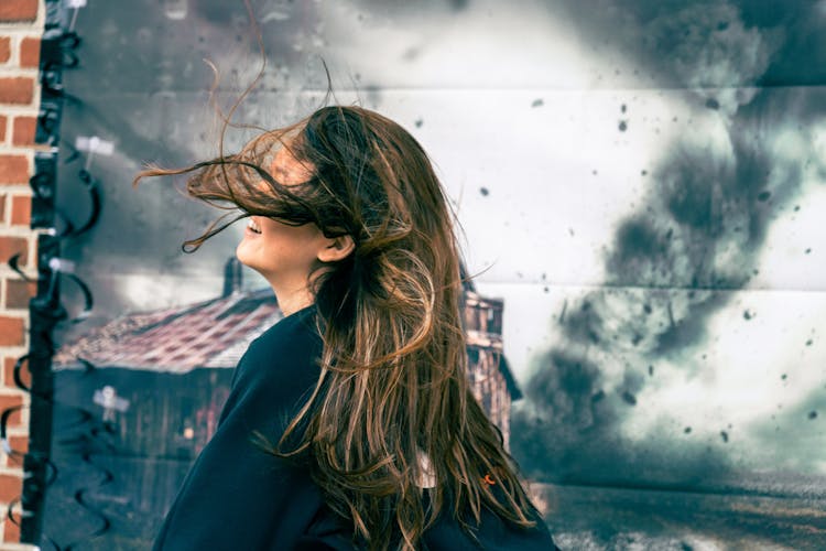 Woman With Hair On Wind