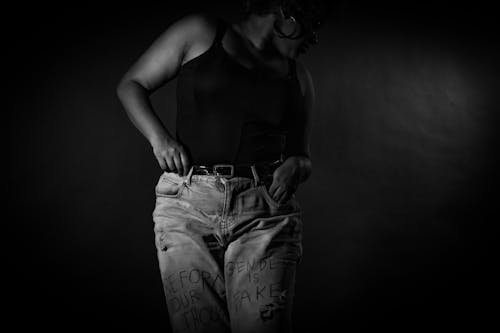 Grayscale Photo of Woman in Denim Jean