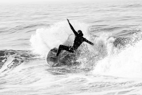 Man Surfing on Sea Waves