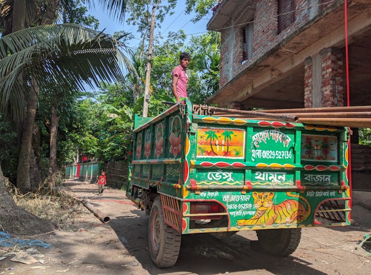 A Man Standing On The Truck