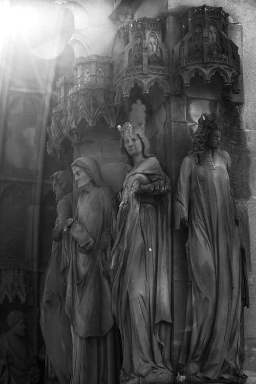 Grayscale Photo of Statues