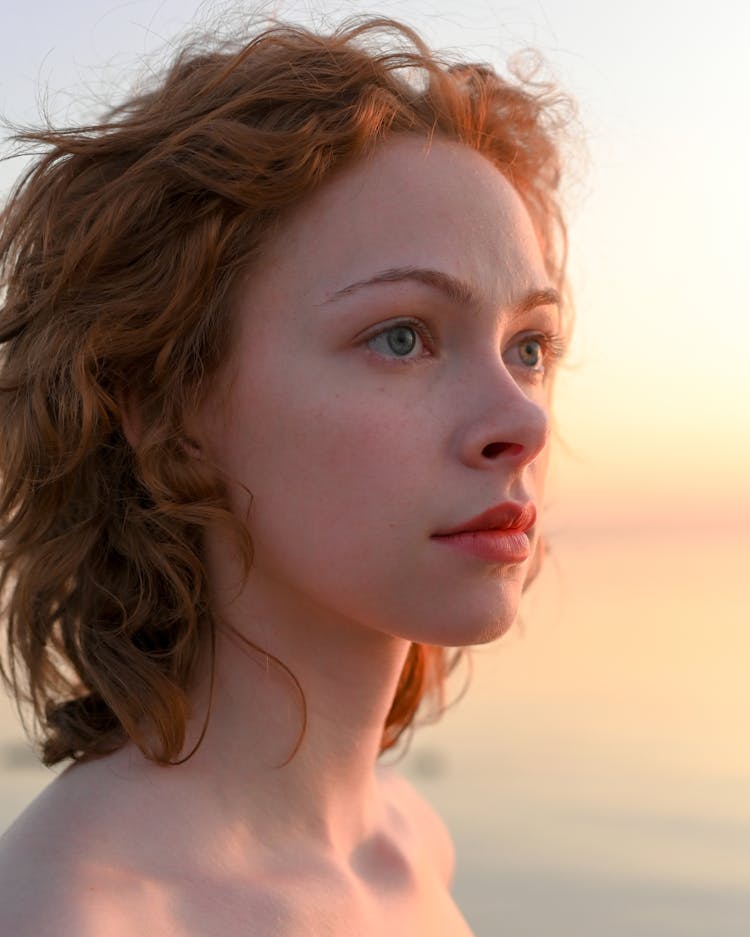 Interesting Face Of Attractive Redhead Woman At Sunset