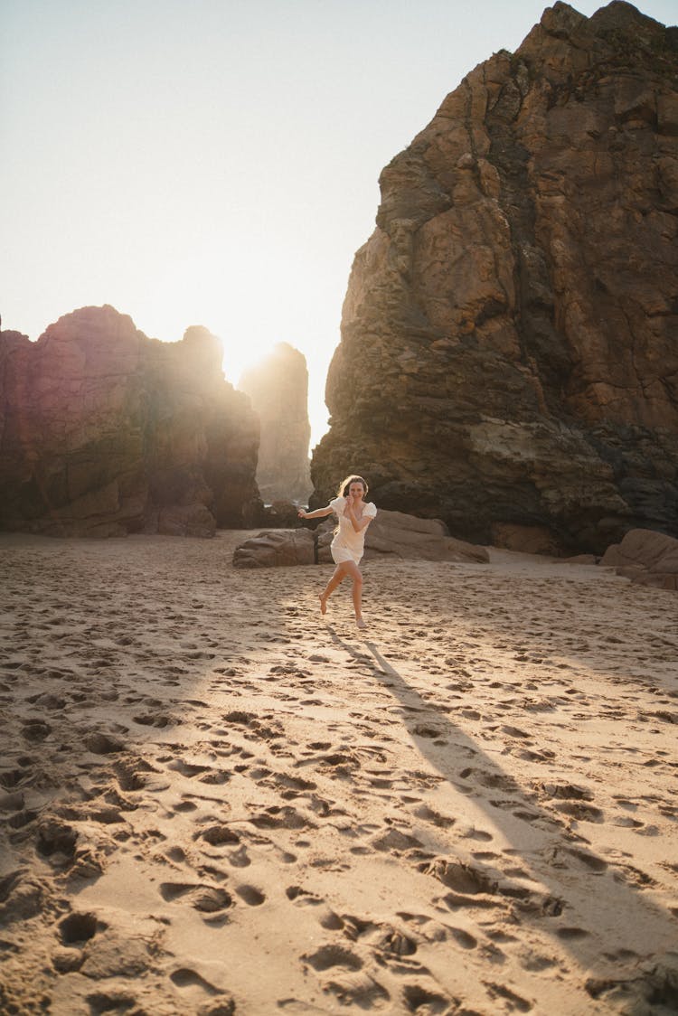 Woman Running On The Beach 