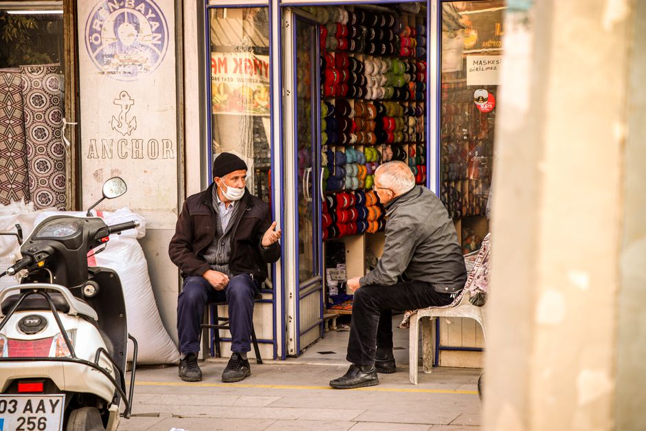 neighbors talking outside shop