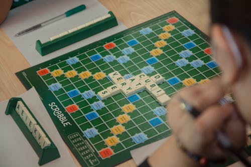 Person Playing Scrabble