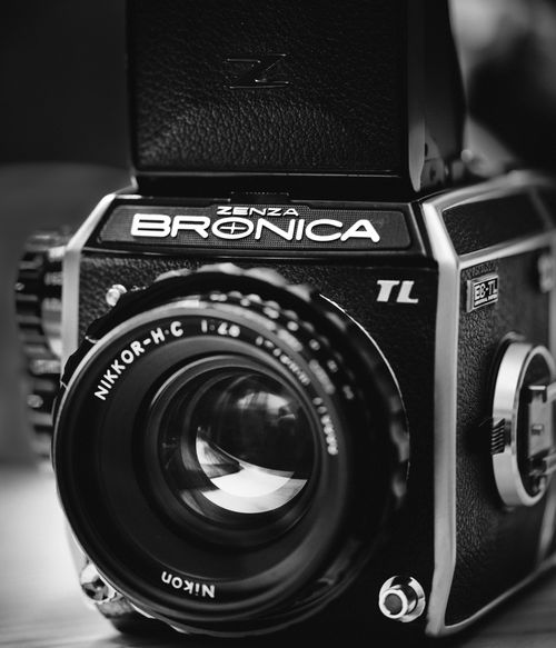 Free Black and white close-up of a vintage Zenza Bronica TL film camera lens and body. Stock Photo